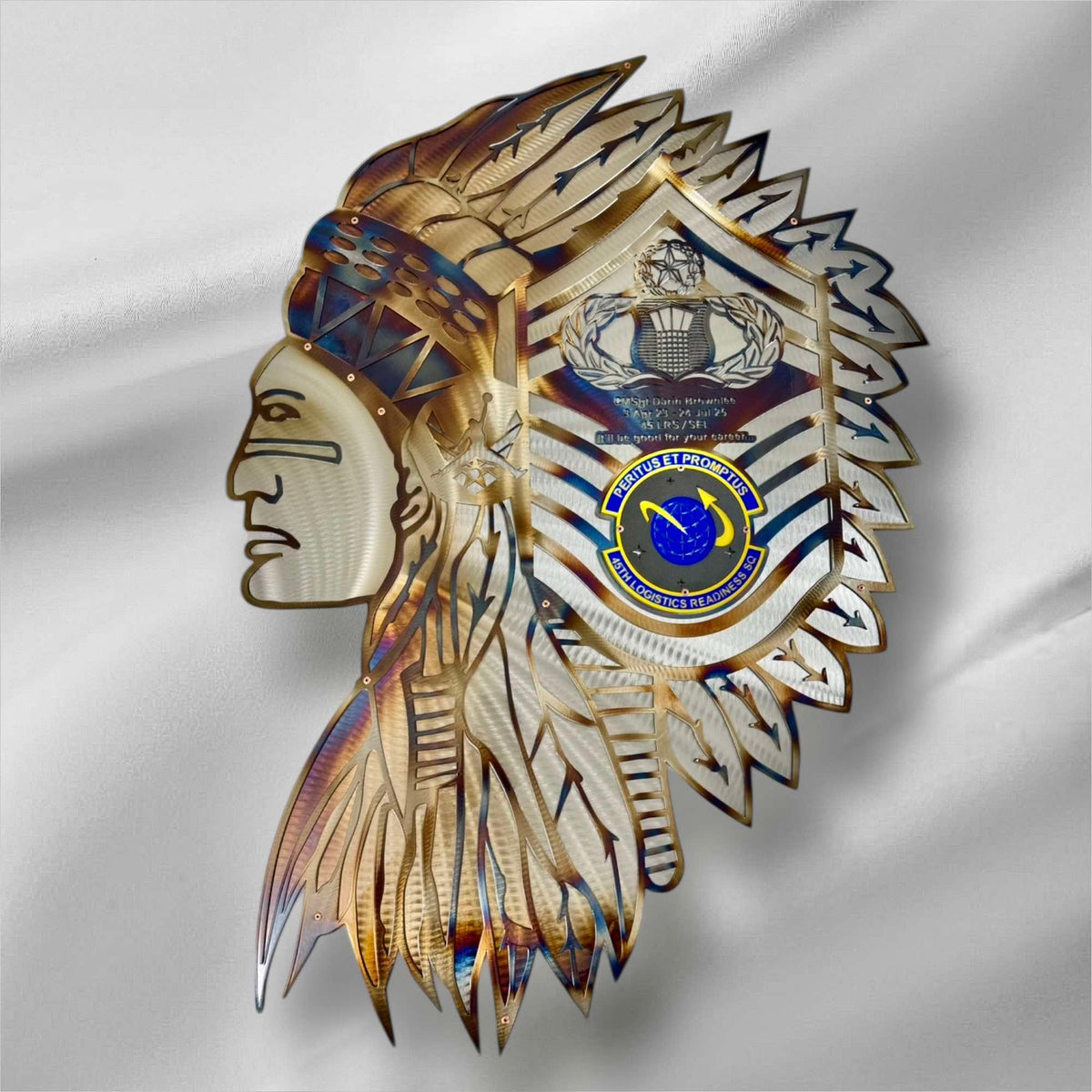 Decorative headpiece with feathers on a white fabric background